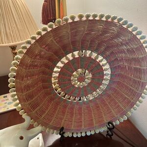 Pink and White Woven Decorative bowl with shells.